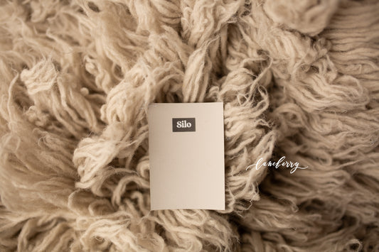 Close-up of simmering smoke flokati  with silo nn paper